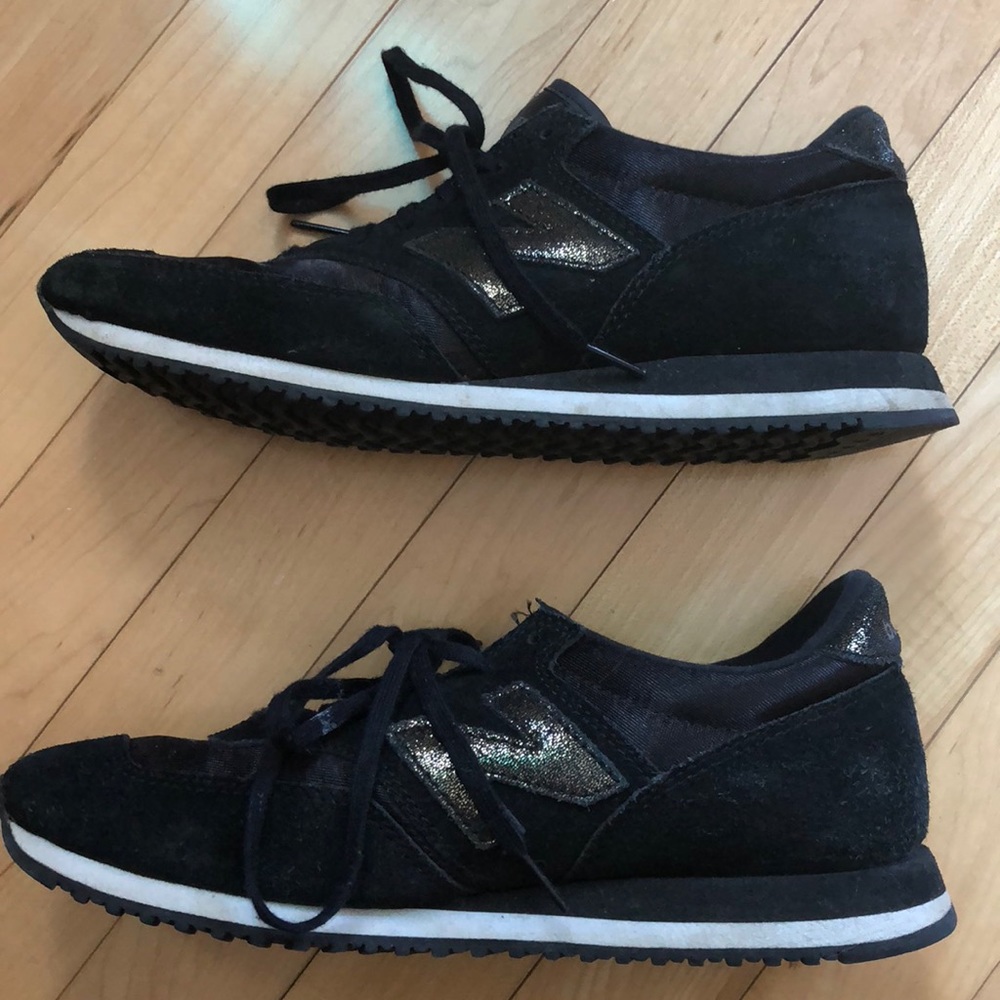 Black and gold new balance sneakers